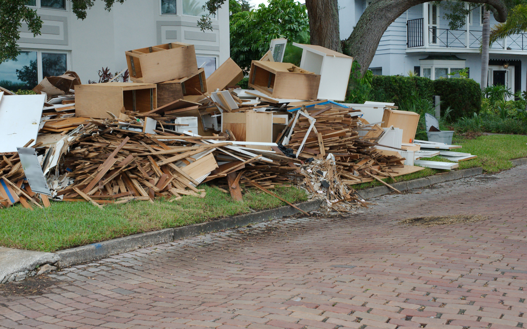Piles Of Trash And Furniture In Front Lawn For Pickup